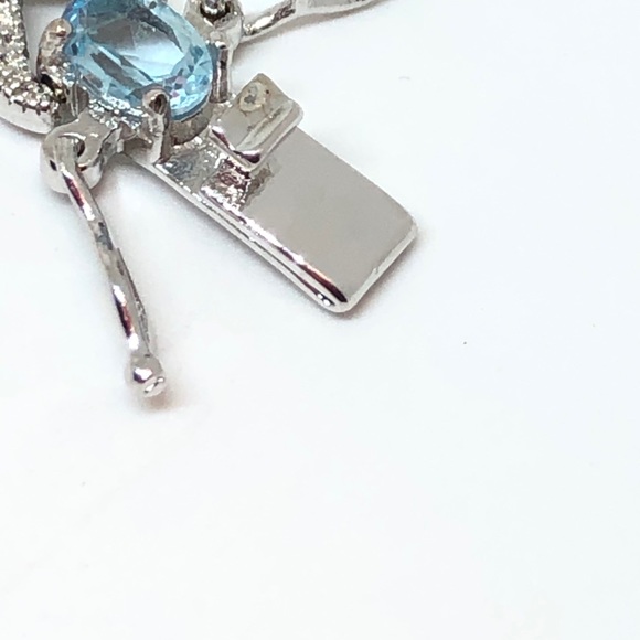 Rhodium Plated Blue Topaz Infinity Bracelet - Picture 7 of 11